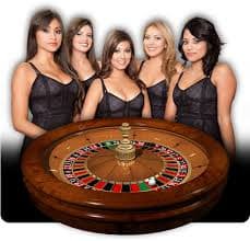 Live dealer conducting Infinite Blackjack at surga33 login studio with multiple player hands visible on screen